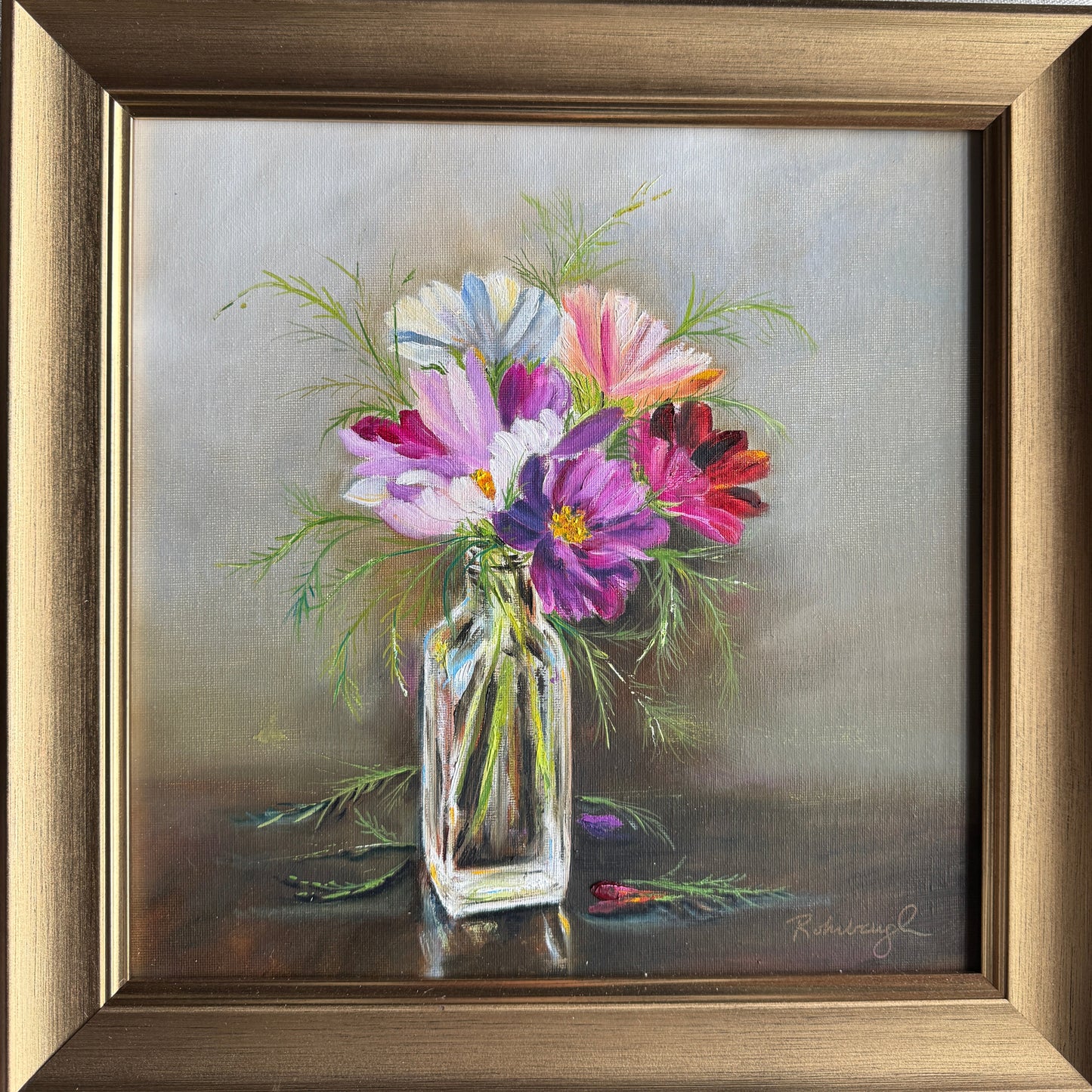 Oil painting of cosmos flowers in a glass bottle framed in gold.